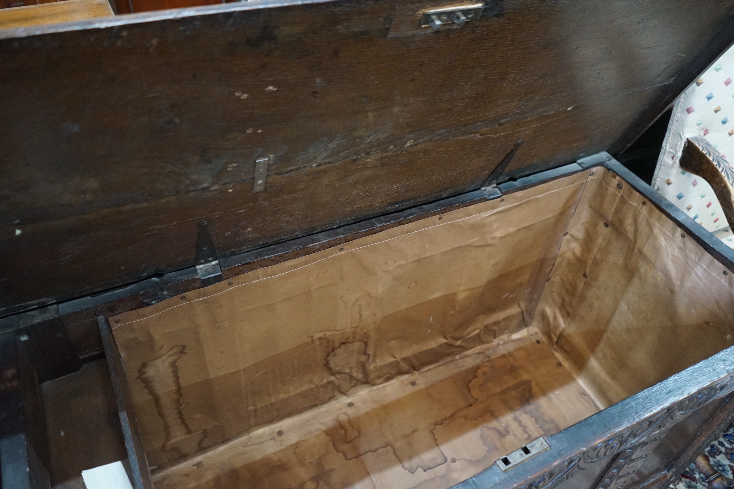 A late 17th / early 18th century carved oak coffer, length 127cm, depth 52cm, height 73cm